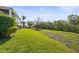 Backyard featuring a lush green lawn perfect for outdoor activities, providing plenty of space at 4109 Cobia Ct, Palmetto, FL 34221