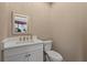 Cozy bathroom with white vanity, a modern square mirror, and a white toilet at 4109 Cobia Ct, Palmetto, FL 34221