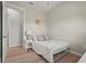 Bedroom featuring neutral walls, light wood floors, and a minimalist white bed frame at 4109 Cobia Ct, Palmetto, FL 34221