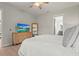 Relaxing bedroom with a large dresser, tv, and ensuite bathroom access for added convenience at 4109 Cobia Ct, Palmetto, FL 34221