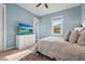 Comfortable bedroom features a light blue wall and a dresser with a television at 4109 Cobia Ct, Palmetto, FL 34221