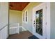 Inviting home entry with wood ceiling, an decorative glass door, and secure entry system at 4109 Cobia Ct, Palmetto, FL 34221