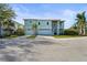 Charming two-story home with a two-car garage, brick driveway, and a private entrance staircase at 4109 Cobia Ct, Palmetto, FL 34221