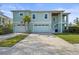 Charming two-story home with a two-car garage, brick driveway, and a private entrance staircase at 4109 Cobia Ct, Palmetto, FL 34221