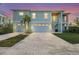 Charming two-story home with a two-car garage, brick driveway, and a private entrance staircase at 4109 Cobia Ct, Palmetto, FL 34221
