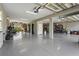 Spacious garage with high ceilings, epoxy floors, and ample room for multiple vehicles and storage at 4109 Cobia Ct, Palmetto, FL 34221