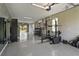 A three-car garage, converted into a fitness center, has an epoxy floor and lots of light at 4109 Cobia Ct, Palmetto, FL 34221