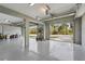 Bright, oversized three-car garage with epoxy floors, garage doors, and outdoor views at 4109 Cobia Ct, Palmetto, FL 34221