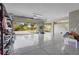 A spacious three car garage with epoxy flooring has ample storage and natural light at 4109 Cobia Ct, Palmetto, FL 34221