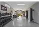 A large garage with fitness equipment and epoxy flooring shows as an in-home gym at 4109 Cobia Ct, Palmetto, FL 34221