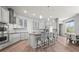 Modern kitchen with stainless steel appliances, gray cabinets, granite countertops, and island with bar seating at 4109 Cobia Ct, Palmetto, FL 34221