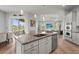 Modern open concept kitchen with granite countertops and island with bar seating at 4109 Cobia Ct, Palmetto, FL 34221