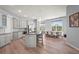 Open-concept kitchen features stainless steel appliances, granite countertops, and a large island with seating at 4109 Cobia Ct, Palmetto, FL 34221