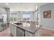 Modern kitchen features stainless steel appliances, gray cabinets, and granite countertops at 4109 Cobia Ct, Palmetto, FL 34221