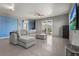 Inviting living room with comfortable seating, a TV, and sliding glass doors to an outside deck at 4109 Cobia Ct, Palmetto, FL 34221