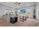 Cozy living room with plush seating, large windows, and an open layout with modern decor at 4109 Cobia Ct, Palmetto, FL 34221