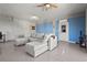Bright living room with sectional couch, dart board, and a door that leads to the outside at 4109 Cobia Ct, Palmetto, FL 34221