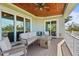 Spacious outdoor porch with a fire pit table, cozy seating, and a panoramic view at 4109 Cobia Ct, Palmetto, FL 34221