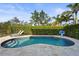 Private swimming pool surrounded by lush landscaping, providing a serene backyard oasis at 4109 Cobia Ct, Palmetto, FL 34221
