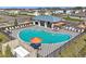 Aerial view of a luxurious community pool area complete with a modern lounge and comfortable seating at 4206 112Th E St, Palmetto, FL 34221