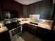 Gleaming granite countertops, a stainless steel oven, and ample cabinet space make this kitchen a chef's delight at 425 30Th W Ave # C112, Bradenton, FL 34205