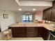 The kitchen flows seamlessly into the living room, creating a modern, open space perfect for entertaining and daily living at 425 30Th W Ave # C112, Bradenton, FL 34205
