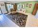Inviting living room featuring decorative rug and chair with ottoman at 425 30Th W Ave # C112, Bradenton, FL 34205