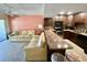Inviting living room with comfortable seating and a breakfast bar overlooking the modern kitchen at 425 30Th W Ave # C112, Bradenton, FL 34205