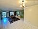 Cozy living room with white tile floors, area rug, natural light, and neutral paint at 425 30Th W Ave # C112, Bradenton, FL 34205