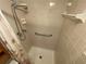 Bathroom shower with handheld shower head and safety bar at 425 30Th W Ave # C112, Bradenton, FL 34205