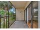 Balcony view features a screened enclosure with sliding glass door access from the living area at 425 30Th W Ave # C208, Bradenton, FL 34205