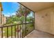 A condo balcony offers a relaxing outdoor space with views of lush greenery and mature trees at 425 30Th W Ave # C208, Bradenton, FL 34205
