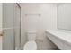 Clean bathroom features a toilet, shower, and a vanity with a sink and mirror at 425 30Th W Ave # C208, Bradenton, FL 34205