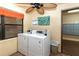 Community laundry room offers multiple washers and dryers for resident convenience at 425 30Th W Ave # C208, Bradenton, FL 34205