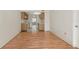 Open living and kitchen area with wood floors and tile flooring at 425 30Th W Ave # C208, Bradenton, FL 34205