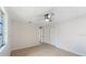 Open bedroom with a ceiling fan, good natural light, and closet at 425 Skylark Nw Ln, Port Charlotte, FL 33952