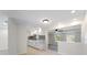 Bright, modern kitchen featuring white cabinets, granite countertops, and stainless steel appliances at 425 Skylark Nw Ln, Port Charlotte, FL 33952