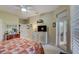 Bedroom featuring ceiling fan, television, dresser, and doorway to a walk-in closet at 4250 Turnberry Cir, North Port, FL 34288