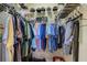 Walk-in closet with organized clothing racks and shelving for shoes and accessories at 4250 Turnberry Cir, North Port, FL 34288