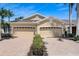 Spacious home featuring a three-car garage, paver driveway, and manicured landscaping, offering both convenience and aesthetic appeal at 4250 Turnberry Cir, North Port, FL 34288