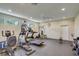 Well-equipped gym with various machines, weights, and a ceiling fan at 4250 Turnberry Cir, North Port, FL 34288