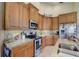 Well-equipped kitchen featuring stainless steel appliances, granite countertops, and ample cabinet space at 4250 Turnberry Cir, North Port, FL 34288