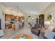 Spacious living area with a kitchen, dining room, and sitting area, perfect for entertaining guests at 4250 Turnberry Cir, North Port, FL 34288