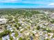 Community aerial view with tree-lined streets highlighting property location close to shops, restaurants and roadways at 4409 Maceachen Blvd, Sarasota, FL 34233