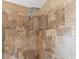 Close-up of tiled shower showing the shower head with a stream of water at 4622 Meadowview Cir, Sarasota, FL 34233