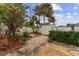 Well-maintained backyard featuring lush landscaping, a storage shed, and a paved patio area perfect for outdoor activities at 4655 Payne St, North Port, FL 34287