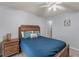 Bedroom features ceiling fan, nightstand, and wood floors at 4655 Payne St, North Port, FL 34287