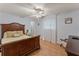 Comfortable bedroom with wood floors, ceiling fan, and natural light at 4655 Payne St, North Port, FL 34287