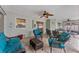 Relaxing covered patio with comfortable seating, ceiling fans, and a view of the backyard and waterfront at 4655 Payne St, North Port, FL 34287