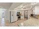 Well-lit kitchen features white cabinets, granite countertops, stainless steel appliances, and tile flooring at 4655 Payne St, North Port, FL 34287